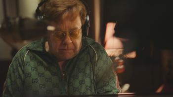 Elton John -- Never Too Late: Elton John wearing headphones