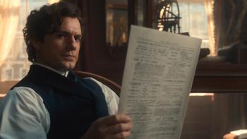 Enola Holmes 3: Henry Cavill reads a paper as Sherlock Holmes.