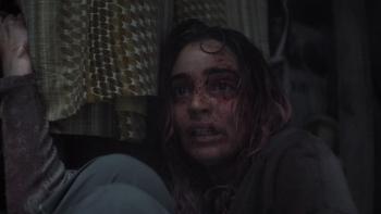 Evil Dead Burn Movie: Bloodied and terrified, Alice (Souheila Yacoub) is backed up against a wall