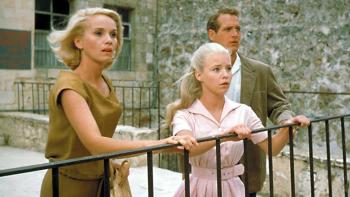 Exodus: Paul Newman, a blond woman, and a blond girl by a railing