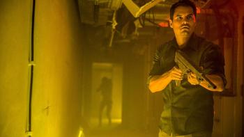 Extinction Movie: Peter holds a gun