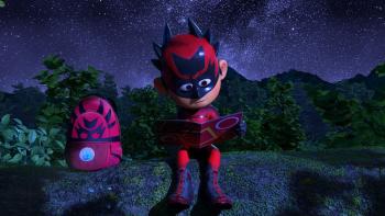 Extinction: Animals Unite! movie: Nimble Kid sits on a log reading a comic book with his backpack beside him