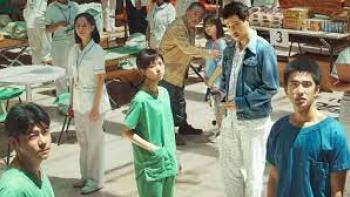 Eye of the Storm: doctors and people stand around