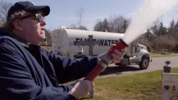Fahrenheit 11/9 Movie: Michael Moore sprays a water hose of "Flint Water"