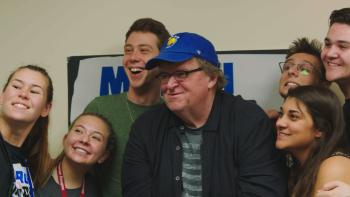 Fahrenheit 11/9 Movie: Michael Moore poses with high school activists