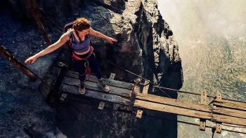 Fall 2: Deadpoint movie: A woman in athletic gear steps onto a narrow loose-wooden-plank bridge far, far above the ground