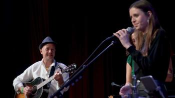A Father's Promise Movie: Mark Barden (left) plays guitar and gazes lovingly at his daughter Natalie (right), who sings into a microphone