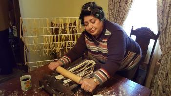 Feast of the Seven Fishes Movie: Marian flattens handmade pasta with a rolling pin 
