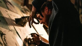 The Thing with Feathers: Benedict Cumberbatch holds up his hand in a claw-like gesture as he draws a crow