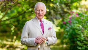 Finding Harmony—A King's Vision: King Charles III wears a light-colored suit and pink tie as he stands in a garden, surrounded by shrubbery