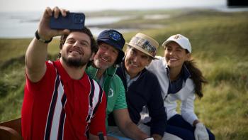 Finnegan’s Foursome movie: Brian Muller takes a selfie of the family on a golf course bench