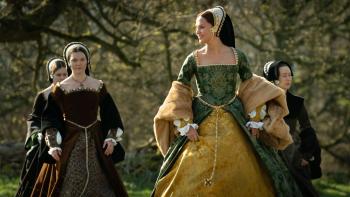Firebrand: Alicia Vikander smiles as she walks through a forest, three ladies following on behind