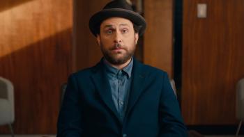 Fool's Paradise Movie: Latte Pronto sits in a chair in an office, looking a bit bewildered