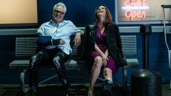 For Worse movie: Bradley Whitford and Amy Landecker sit on a bench, laughing