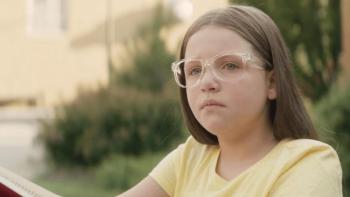 Forgiveness Girl movie: Scarlett Diamond sits outside of school
