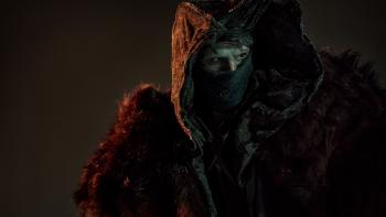 Frankenstein Movie: Wearing a fur cloak, a hood, and a mask across its mouth, the Creature (Jacob Elordi) glowers