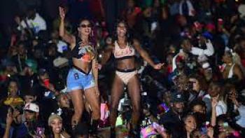 Freaknik scene 3: 2 young women in large crowd