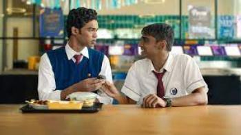 Friday Night Plan scene 2:  Two Indian young men eat lunch at a cafeteria