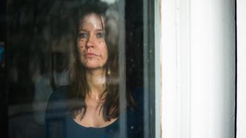 From Black: Anna looks out the window. 