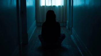 From Black: Anna in the hallway. 