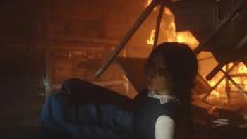 From the Ashes Movie: Young woman in burning room