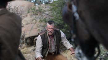Frontier Crucible Movie: Charlie McKee (Thomas Jane) crouches, arms outstretched, as if ready to jump into a fight