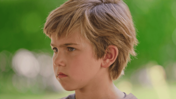 The Furry Fortune: A boy looks with a stern look on his face