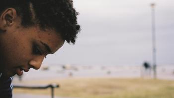 Bird: A young biracial girl looks at the ground
