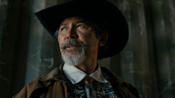 Get Fast movie: Lou Diamond Phillips looks on in black cowboy hat and brown jacket