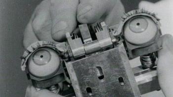 Ghost in the Machine movie: a close up black and white photo of artificial intelligence machine with eyes