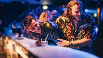 Gold Brick: Two men laugh at a bar