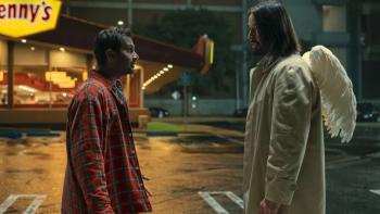 Good Fortune movie: Nighttime shot of Aziz Ansari talking to Keanu Reeves (an angel with wings) outside a Denny's restaurant