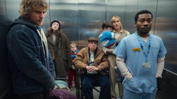 Goodbye June movie: Johnny Flynn, Andrea Riseborough, Timothy Spall, Kate Winslet, and Fisayo Akinade stand in an elevator with two young children