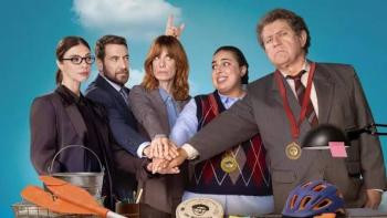 Go Team! Movie: Five people in formal attire, hands joined, with medals in a playful setting.