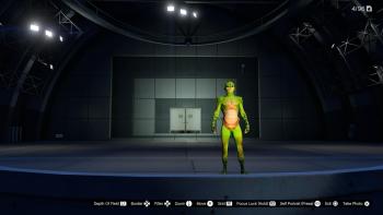Grand Theft Hamlet: A green lizard-like avatar stands on a large, otherwise empty stage