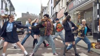 Greatest Days: A group of people dance in the street