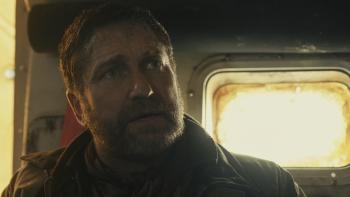 Greenland 2: Migration Movie: On board a lifeboat, John Garrity (Gerard Butler) expresses concern about something
