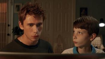 Griffin in Summer: Griffin studies Brad as he stares as the computer screen 