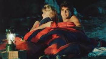 Grizzly II:  George Clooney and woman under sleeping bag