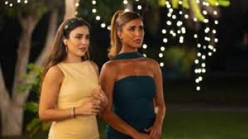 Groom & Two Brides: Two MENA women stand together