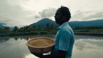 Groundswell: Man carries a basket of something.