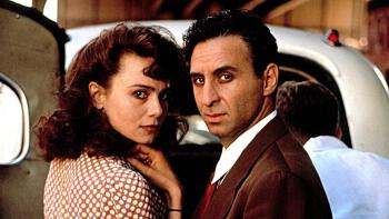 Enemies, a Love Story: Lena Olin and Ron Silver look at the camera