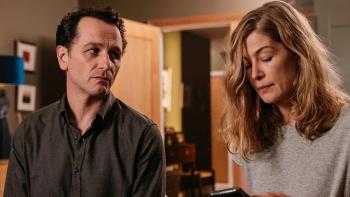 Hallow Road: Matthew Rhys looks at Rosamund Pike as the two sit on a bed, distressed