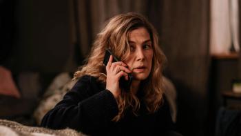 Hallow Road: Rosamund Pike looks panicked as she holds a phone to her ear