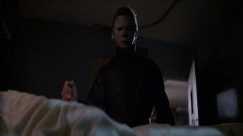 Halloween II: Michael Myers wears a white mask and plunges a knife into a hospital bed
