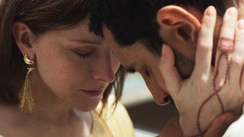 Hamlet: Morfydd Clark holds Riz Ahmed's head so they're forehead to forehead