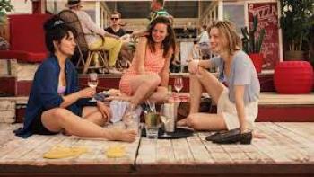 Happy Ending: Three women sit on the floor drinking
