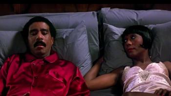 Harlem Nights: Richard Pryor and Berlinda Tolbert lying in bed together.