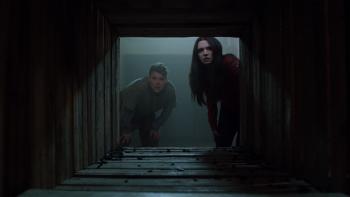 Haunt Movie: Harper and Evan look down a creepy tunnel