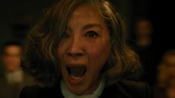 A Haunting in Venice Movie: Medium Joyce Reynolds (Michelle Yeoh) experiences something terrifying during a séance